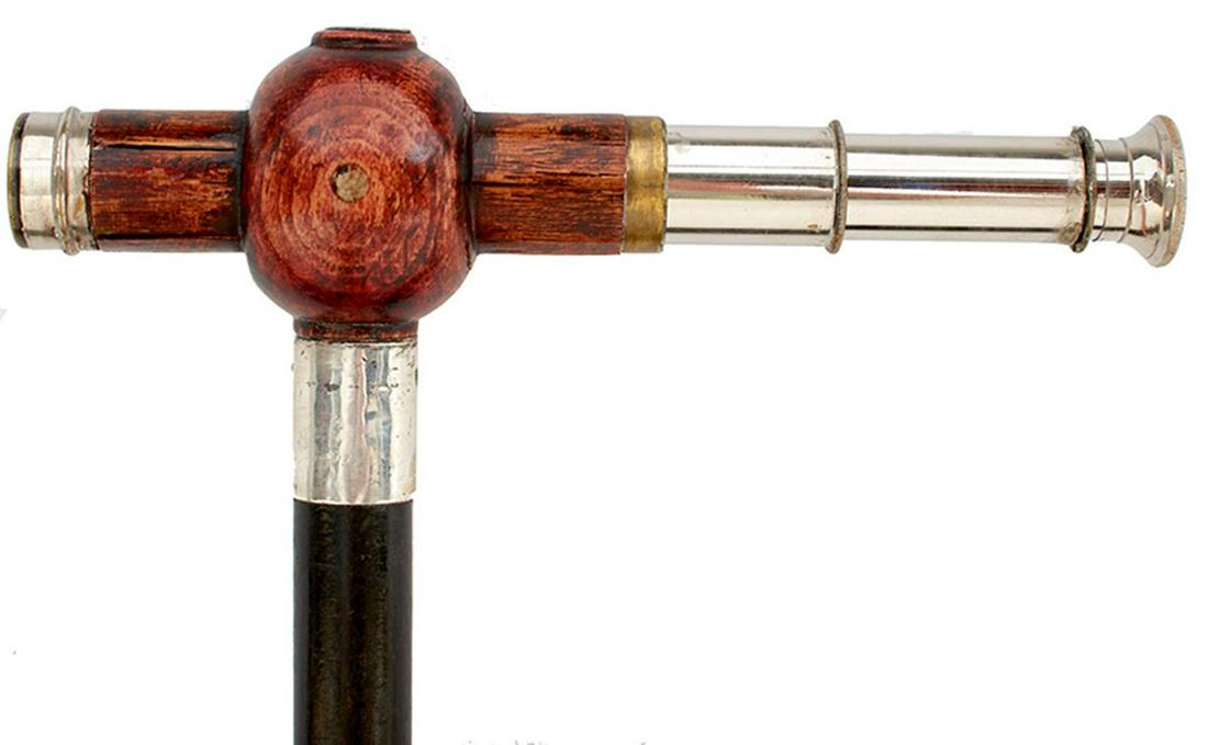 A GADGET WALKING STICK, the handle incorporating a (1 of 10)