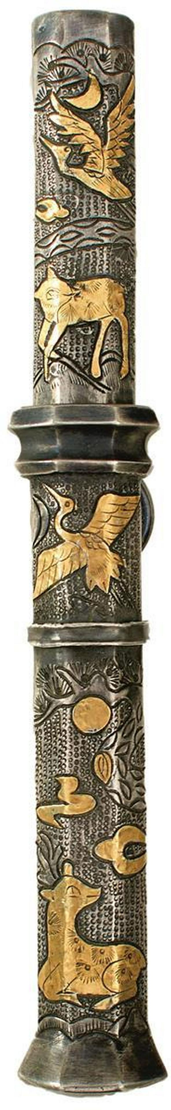 A KOREAN TROUSSE OR KNIFE SET: A KOREAN TROUSSE OR KNIFE SET, 7cm blade, white metal mounted hilt decorated with scrolling foliage and animals highlighted in yellow metal, contained in its faceted white metal scabbard, decorated to