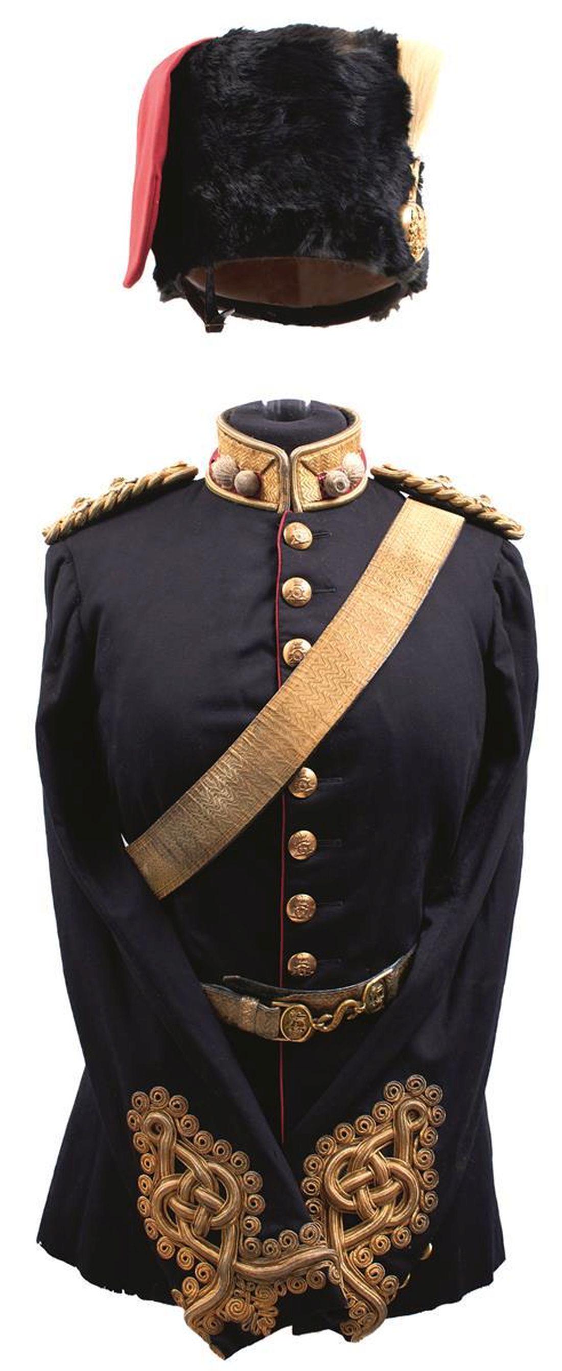 A VICTORIAN ROYAL FIELD ARTILLERY OFFICER'S UNIFORM ENSEMBLE: A VICTORIAN ROYAL FIELD ARTILLERY OFFICER'S UNIFORM ENSEMBLE, comprising, black fur busby by Daniels & Co of Woolwich, scarlet cloth bag, gilt flaming grenade plume holder, white brush plume, leather 