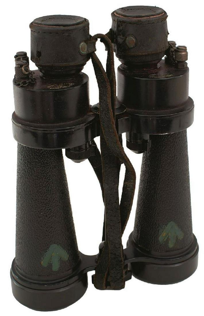 A PAIR OF BARR & STROUD WAR DEPARTMENT NAVAL BINOCULARS, contained in their leather case, together: A PAIR OF BARR & STROUD WAR DEPARTMENT NAVAL BINOCULARS, contained in their leather case, together with a large brass shell case. (2)