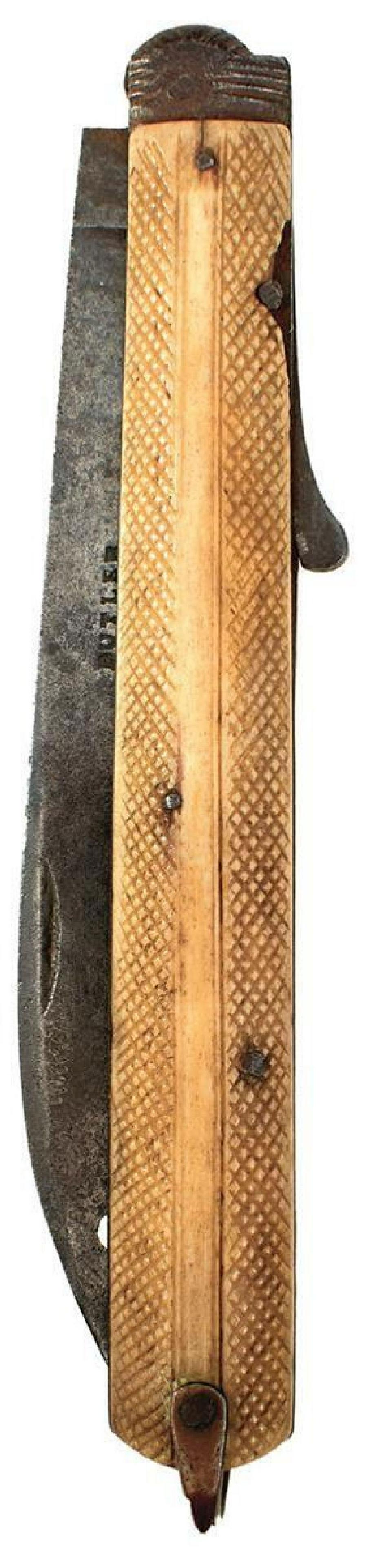 A LATE 18TH CENTURY FOLDING KNIFE BY BUTLER, 13.5cm blade pierced with a hole behind the tip,: A LATE 18TH CENTURY FOLDING KNIFE BY BUTLER, 13.5cm blade pierced with a hole behind the tip, two-piece chequered horn grips.