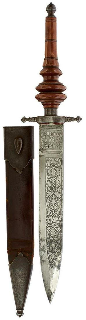 A LATE 19TH CENTURY SPANISH SOCKET BAYONET, 24cm blade etched with scrolling foliage, ANO DE 1884: A LATE 19TH CENTURY SPANISH SOCKET BAYONET, 24cm blade etched with scrolling foliage, ANO DE 1884 and FABRICA DE TOLEDO, characteristic hilt with turned steel crossguard and pommel, ring turned wooden
