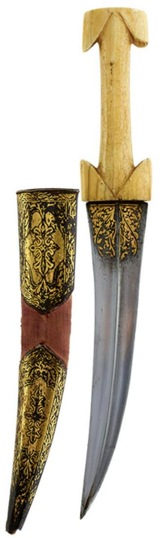 A 19TH CENTURY BALKAN OR OTTOMAN JAMBIYA, 23.75cm curved blade with raised medial ridge and: A 19TH CENTURY BALKAN OR OTTOMAN JAMBIYA, 23.75cm curved blade with raised medial ridge and decorated with panels of scrolling foliage to either side of the forte in gold koftgari, characteristic carv
