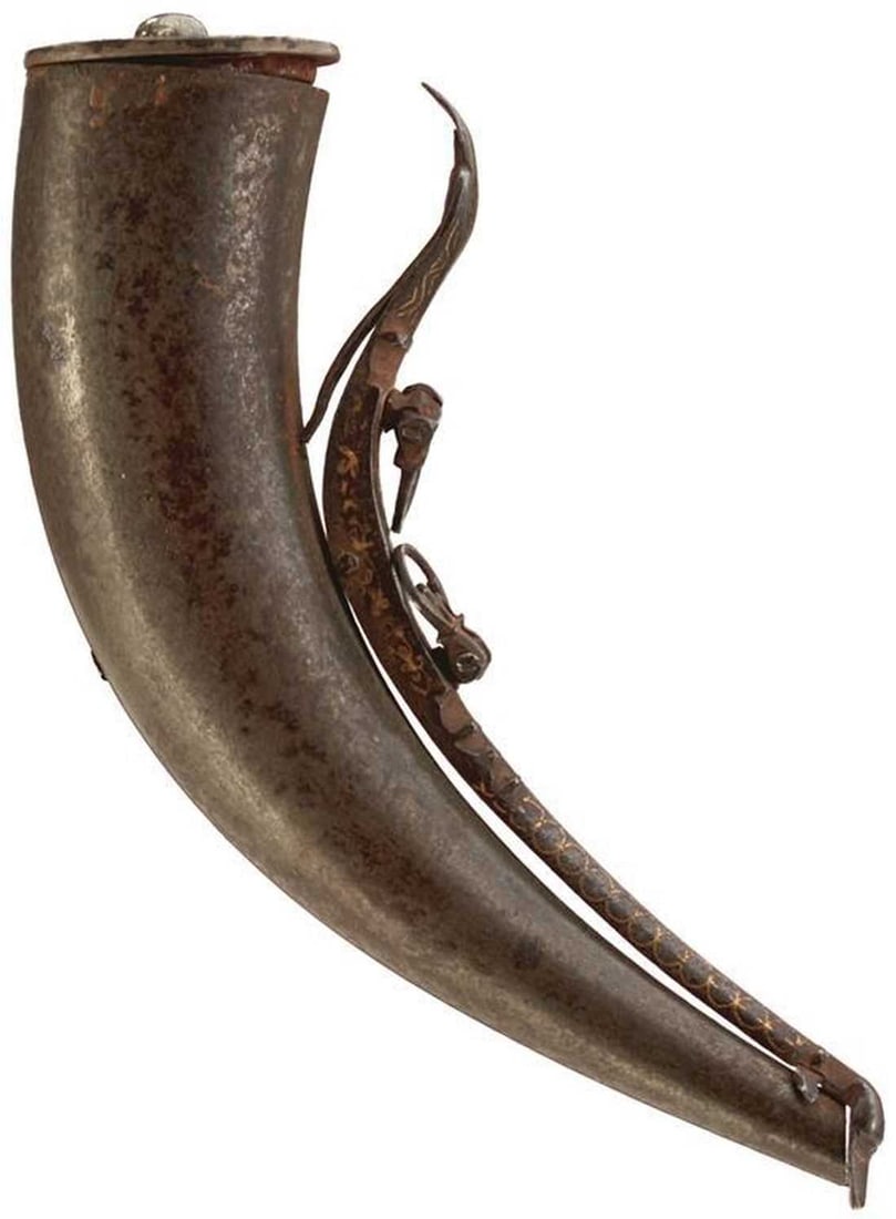 A 19TH CENTURY OTTOMAN WOOTZ DAMASCUS POWDER OR PRIMING FLASK,: A 19TH CENTURY OTTOMAN WOOTZ DAMASCUS POWDER OR PRIMING FLASK, 15cm curved body of characteristic form, the curving sprung cover arm decorated with scrolling foliage in gold koftgari, the two suspensi