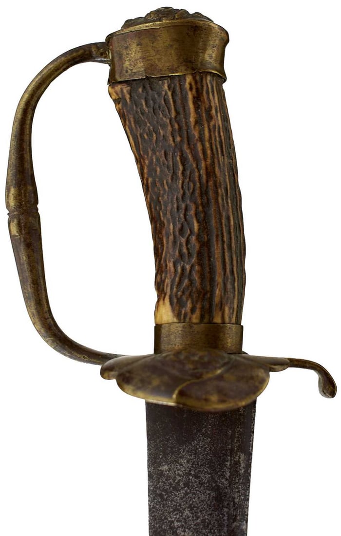 A LATE 17TH CENTURY SERGEANT'S VERSION OF THE MATROSSES INFANTRY HANGER,: A LATE 17TH CENTURY SERGEANT'S VERSION OF THE MATROSSES INFANTRY HANGER, 68.5cm curved fullered blade stamped with a running wolf or fox motif and a stylized anchor to either side, characteristic bras