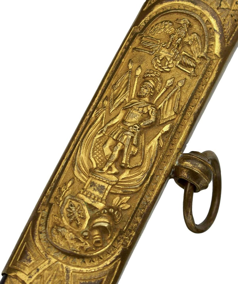 AN ORNATE FRENCH NAPOLEONIC OFFICER'S SABRE,: AN ORNATE FRENCH NAPOLEONIC OFFICER'S SABRE, 84cm double fullered blade with clipped back point etched and gilt against a blued ground with foliage and trophies of arms, brass mounted hilt with forwar