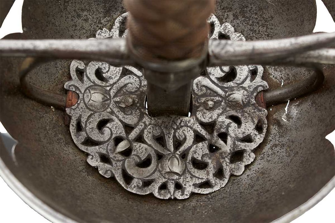 A 17TH CENTURY CUP HILT RAPIER,: A 17TH CENTURY CUP HILT RAPIER, 90.5cm flattened diamond section blade incised to either side in the short central fuller IHN SOLINGEN, characteristic pierced foliate form cup incised with segments of