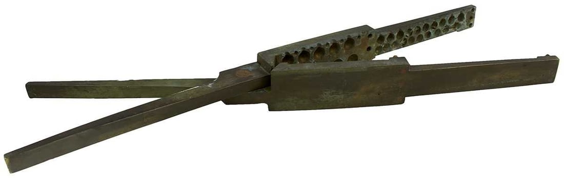 A MASSIVE BRITISH NAVAL BRASS GANG MOULD,: A MASSIVE BRITISH NAVAL BRASS GANG MOULD, with provision for casting 10 musket size balls and 20 pistol balls, maker's stamp HR. 91cm Long These huge rare moulds were issued as part of the ship's stor