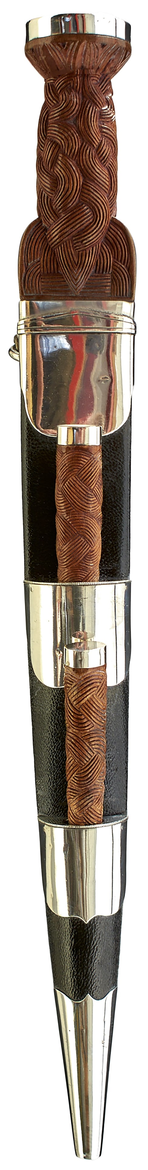 A WHITE METAL MOUNTED SCOTTISH DRESS DIRK,: A WHITE METAL MOUNTED SCOTTISH DRESS DIRK, 28cm fullered blade with faceted back edge, characteristic white metal mounted hilt with carved basket weave wooden grip, in its white metal mounted leather 