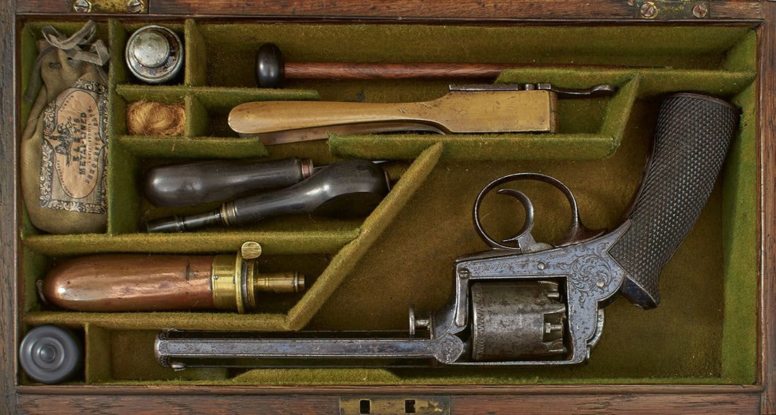 A SCARCE CASED 90-BORE FIVE-SHOT PERCUSSION DEAN, ADAMS & DEANE REVOLVER,: A SCARCE CASED 90-BORE FIVE-SHOT PERCUSSION DEAN, ADAMS & DEANE REVOLVER, 5.25inch border engraved sighted octagonal blued barrel, marked DEANE, ADAMS & DEANE, 30 KING WILLIAM ST LONDON BRIDGE, chevro