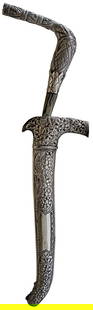 A LATE 19TH OR EARLY 20TH CENTURY INDONESIAN SUMATRAN RENCONG (ACEH) OR DAGGER,: A LATE 19TH OR EARLY 20TH CENTURY INDONESIAN SUMATRAN RENCONG (ACEH) OR DAGGER, 22.5cm recurved slender pamor blade, characteristic fine white metal mounted angled hilt profusely decorated with geomet