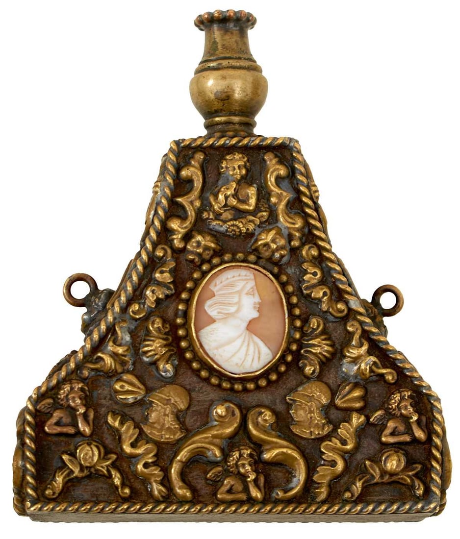 A FINE ITALIAN PRIMING FLASK,: A FINE ITALIAN PRIMING FLASK, the iron body finely applied with chased brass ornaments on a Classical theme, to include cherubs, profile busts of warriors, foliage, flower heads, the whole within rope