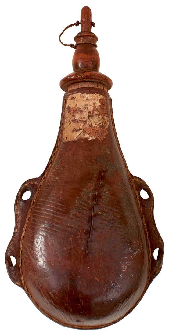A RARE ENGLISH CIVIL WAR PERIOD POWDER FLASK,: A RARE ENGLISH CIVIL WAR PERIOD POWDER FLASK, the leather covered wooden body with four suspension holes, turned fruit wood top and stopper. Partial old label.