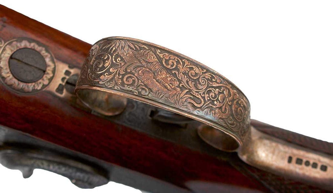 A FINE AND RARE SILVER MOUNTED .451 PERCUSSION WHITWORTH SPORTING RIFLE BY WATMOUGH,: 33inch sighted barrel fitted with ramp and ladder rear military sights and engraved WHITWORTH PATENT on the top of the breech, border and scroll engraved barrel tang, border and finely scroll engraved