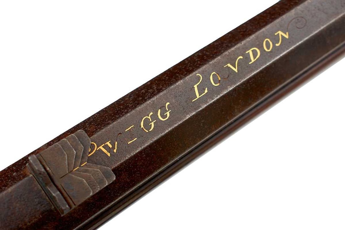 A SCARCE 18-BORE PERCUSSION SPORTING RIFLE BY TWIGG,: 28.25inch sighted octagonal damascus barrel fitted with rear leaf sights and signed in gold TWIGG LONDON and with a foliate flourish at the breech, some losses, border and scroll engraved lock signed