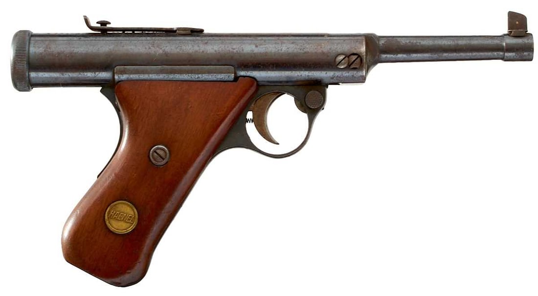 A .177 HAENEL MODEL 28 AIR PISTOL,: 4.25inch sighted blued barrel, blued cylinder stamped with the Model and manufacturer's details, two-piece raked wooden grips, set with a brass maker's tablet on either side, grip safety, serial no.