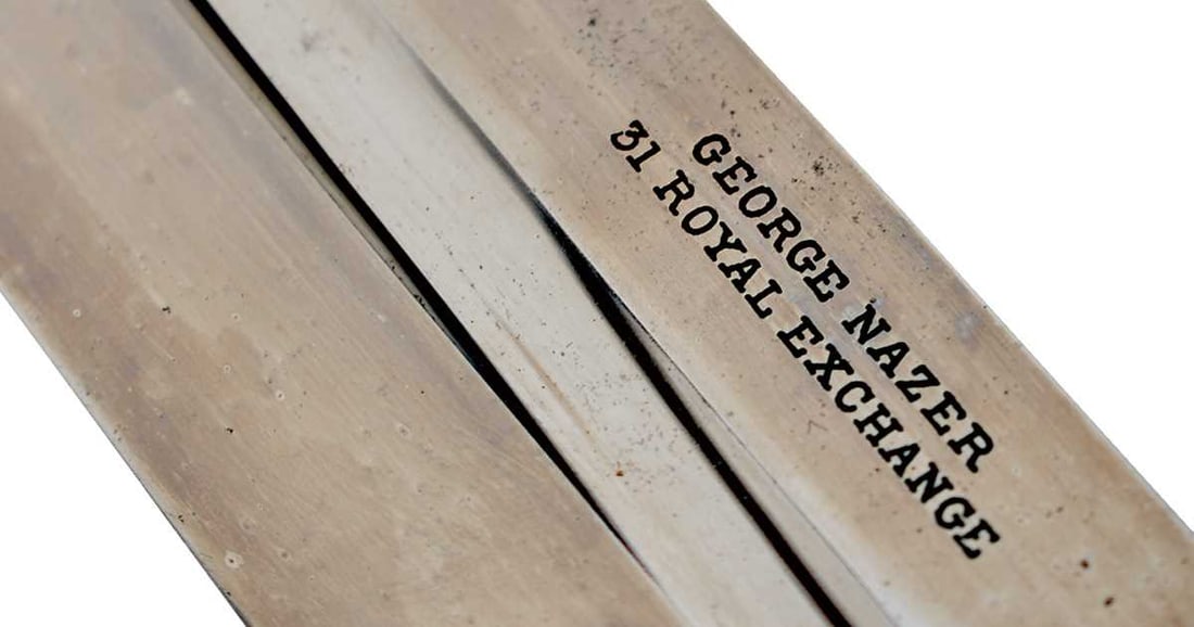 A FINE VICTORIAN BOER WAR PERIOD BOWIE KNIFE BY NAZER,: 23cm clean fullered clipped back blade with all its original polish, stamped GEORGE NAZER 31 ROYAL EXCHANGE, shaped nickel crossguard, two-piece riveted chequered horn grips, the pommel set with a