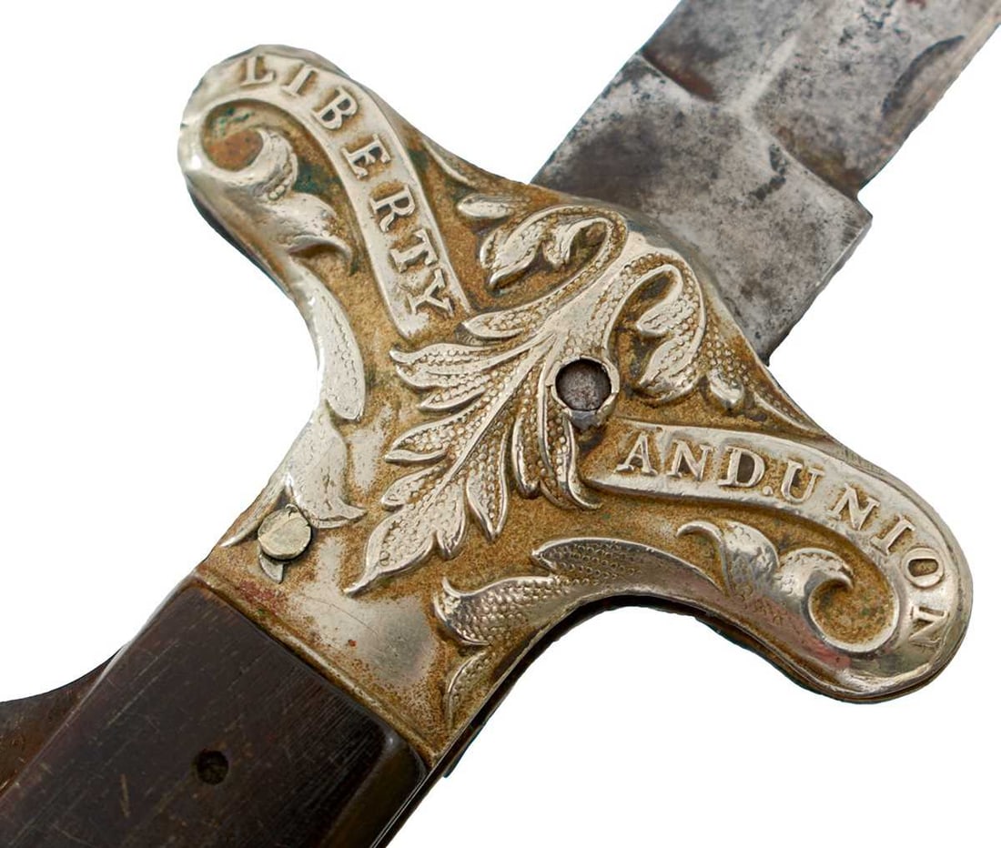 A 19TH CENTURY LIBERTY & UNION FOLDING DIRK OR KNIFE BY WRAGG & SONS,: 9.75cm flattened diamond section blade partially stamped to the forte WRAGG & SONS 38 FURNACE HILL, embossed nickel mounted hilt, the crossguard stamped LIBERTY & UNION, the shaped coffin