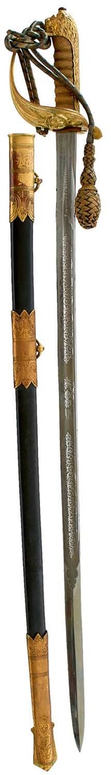 AN INTER-WAR PRESENTATION NAVAL OFFICER'S SWORD,: 80cm slightly curved fullered blade stamped with the serial no. 14825 on the back edge, etched with scrolling foliage and a crowned fouled anchor to one side and scrolling foliage, Royal arms and a