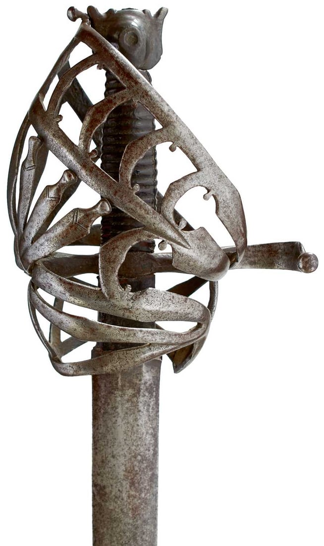 A LATE 17TH CENTURY VENETIAN SCHIAVONA,: 92cm broad sword blade with leather wrapped stepped ricasso, characteristic lattice hilt composed of flattened and flared chevron bars, recurving quillon, characteristic eared pommel with domed punche