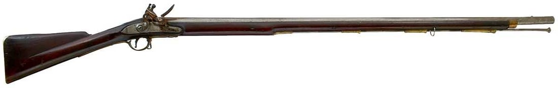 A .750 CALIBRE VOLUNTEER FLINTLOCK SHORT LAND PATTERN MUSKET,: 42.25inch barrel, proofed to the top of the breech, border engraved stepped lock, faintly signed, swan neck cock, full stocked with regulation brass mounts, later steel ramrod. Splits to left side of