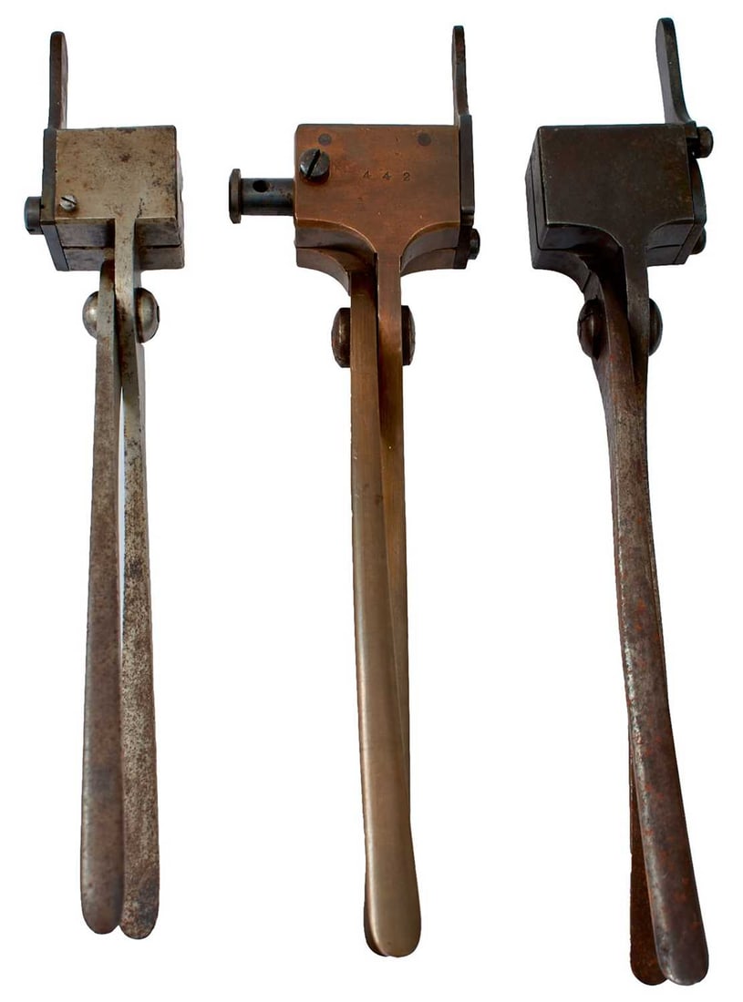 AN ALEXANDER HENRY BULLET MOULD,: the steel body serial no 4239 over AH, together with another for McNaughton, another marked Swinburn (Jacobs) and the last for a Colt Army. (4)