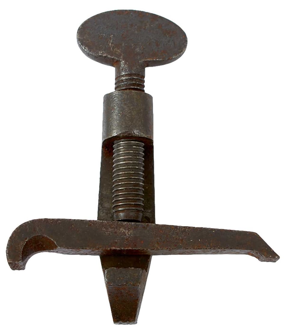 A COLLECTION OF GEORGIAN AND VICTORIAN GUN TOOLS,: to include a blued steel double-ended shotgun tube-shaped Sykes shot charger, a c.1800 British military spring clamp, two wad punches 16 and 12 bore respectively, a British barrel/nipple key for a