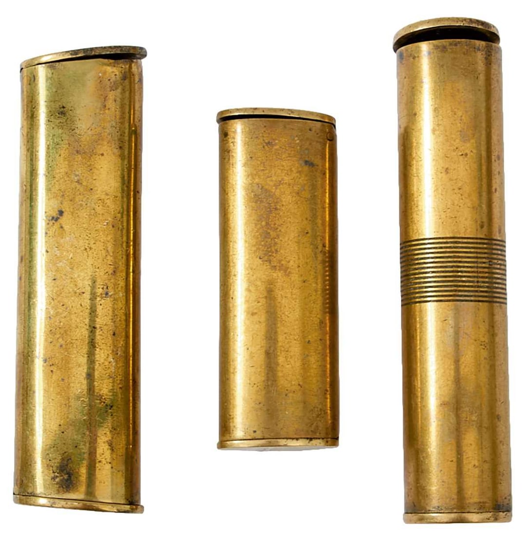 FOUR SHOT CHARGERS,: c.1800-1860, comprising a steel oval tapered one c.1800 with external spring, some light staining, a scarce double-ended brass tube type marked Sykes Patent, missing spring to end, a scarce double-end