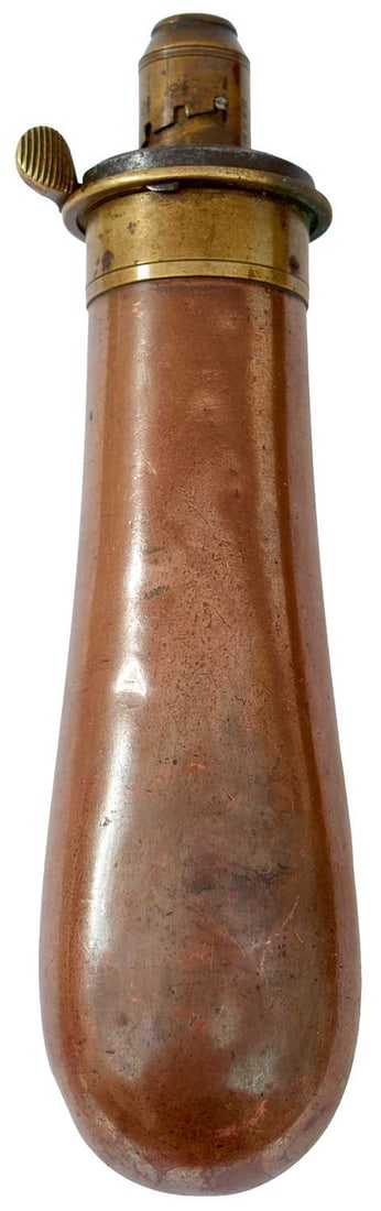 A LARGE BAG RIFLE POWDER FLASK,: copper long tubular body, 5cm overall, the brass top marked Sykes Patent and Extra Quality on top plate. Dents.