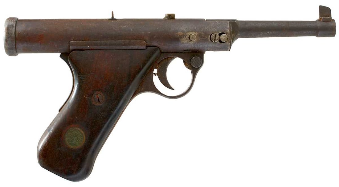 AN ANTIQUE HAENEL AIR PISTOL,: 4.1inch sighted barrel, marked MODEL 28 to the top of the cylinder, two-piece wooden grips set with brass maker's tablets. Spares or repair - pellet stuck in bore.