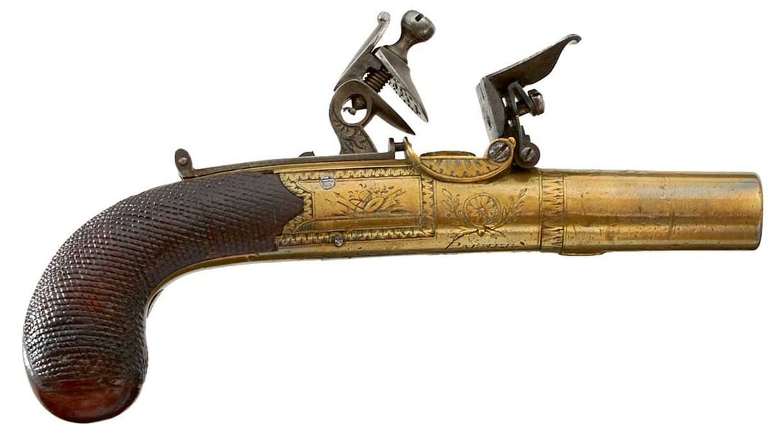 A 54-BORE FLINTLOCK BOXLOCK POCKET PISTOL,: 1.75inch turn-off brass barrel, scallop engraved at the breech, border and scroll engraved rounded brass action decorated with stands of arms and signed Palmer of Rochester, sliding safety, folding