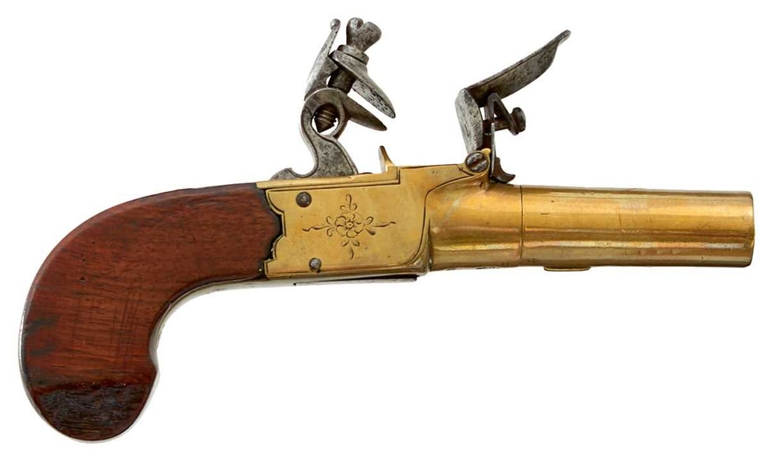 AN 80-BORE FLINTLOCK BOXLOCK POCKET PISTOL,: 2inch turn-off brass barrel, border and foliate engraved brass action signed Catchpool, folding trigger, slab-sided wooden butt. Chip to right side of butt.