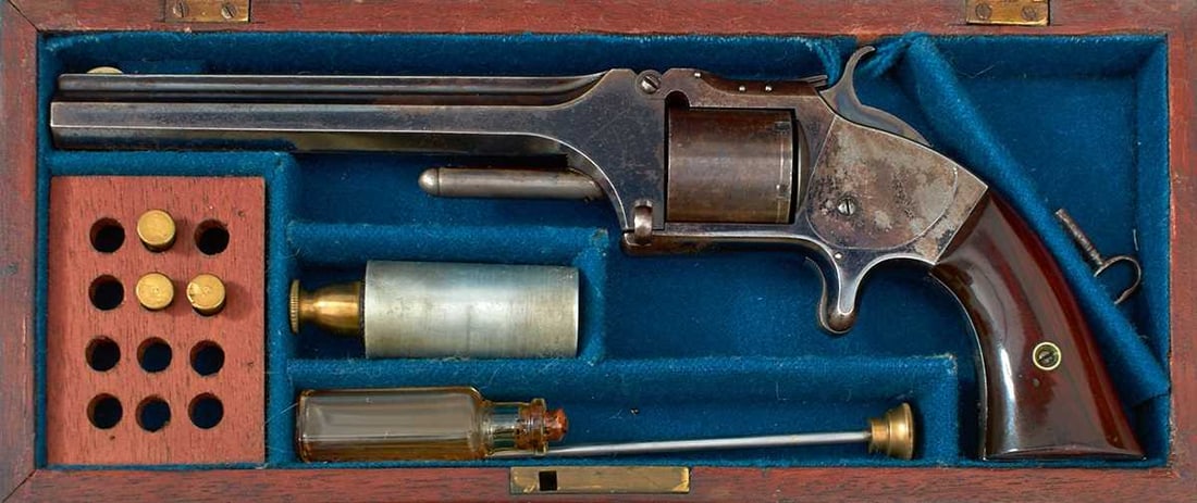 A SCARCE CASED .32 RIMFIRE SMITH & WESSON SIX-SHOT NO.2 ARMY REVOLVER,: 6inch sighted octagonal blued barrel stamped with the manufacturer's details and fitted with a white metal blade foresight, blued cylinder with roll stamped patent details, blued frame, sheath
