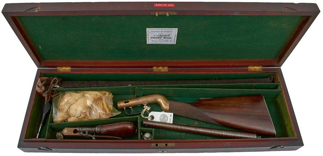 A VERY RARE CASED BUDDING PATENT PERCUSSION WALKING STICK COMBINATION SHOTGUN AND RIFLE,: 12.25inch sighted browned damascus rifle barrel, 26inch sighted browned damascus barrel with original sleeve, border and scroll engraved rounded action decorated with pheasant and a hound, engraved to