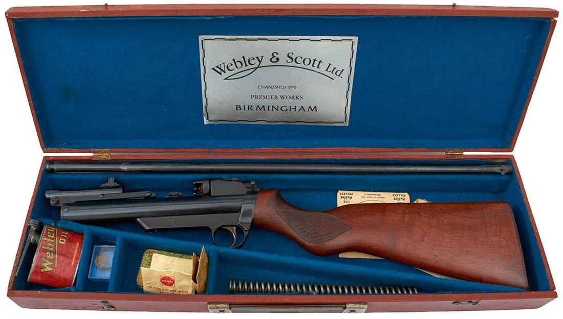 A CASED ANTIQUE WEBLEY SERVICE AIR RIFLE MKII ENSEMBLE,: 25inch sighted blued .177 and .22 barrels, the cylinder stamped with the Model and Manufacturer's patent details, serial no. S12917 stamped to the back of the trigger guard, pivoting rear peep sight,