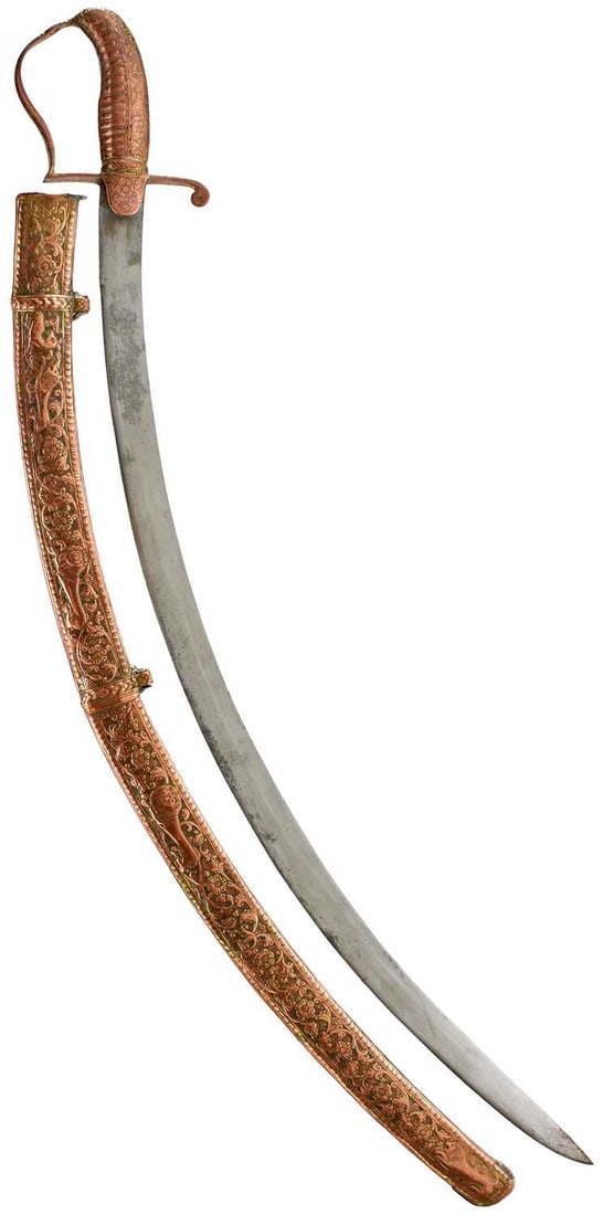 A 19TH CENTURY SIKH SHAMSHIR SHIKARGAR,: 72.5cm sharply curved blade, characteristic copper stirrup hilt decorated with scrolling foliage and flowerheads, traces of gilt finish, in its embossed copper scabbard profusely decorated with