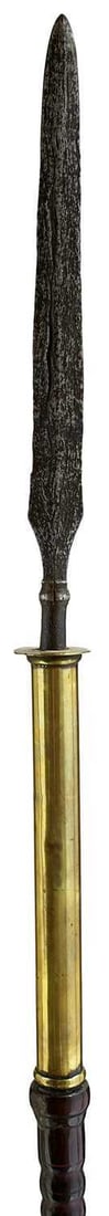 A 19TH CENTURY MALAYSIAN SPEAR,: 25.5cm flattened diamond section tapering leaf-shaped pamor blade, possibly earlier, mounted with stepped yellow metal collar and ribbed wooden shaft, complete with its sheath. 141cm over all.