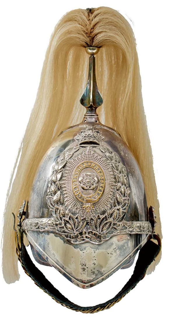 A YORKSHIRE DRAGOONS OTHER RANKS 1871 PATTERN HELMET,: the white metal skull with white metal fittings, crowned laurel wreath helmet plate with central rose with regimental title in garter surround, the whole on a faceted rayed star, laurel leaf head band