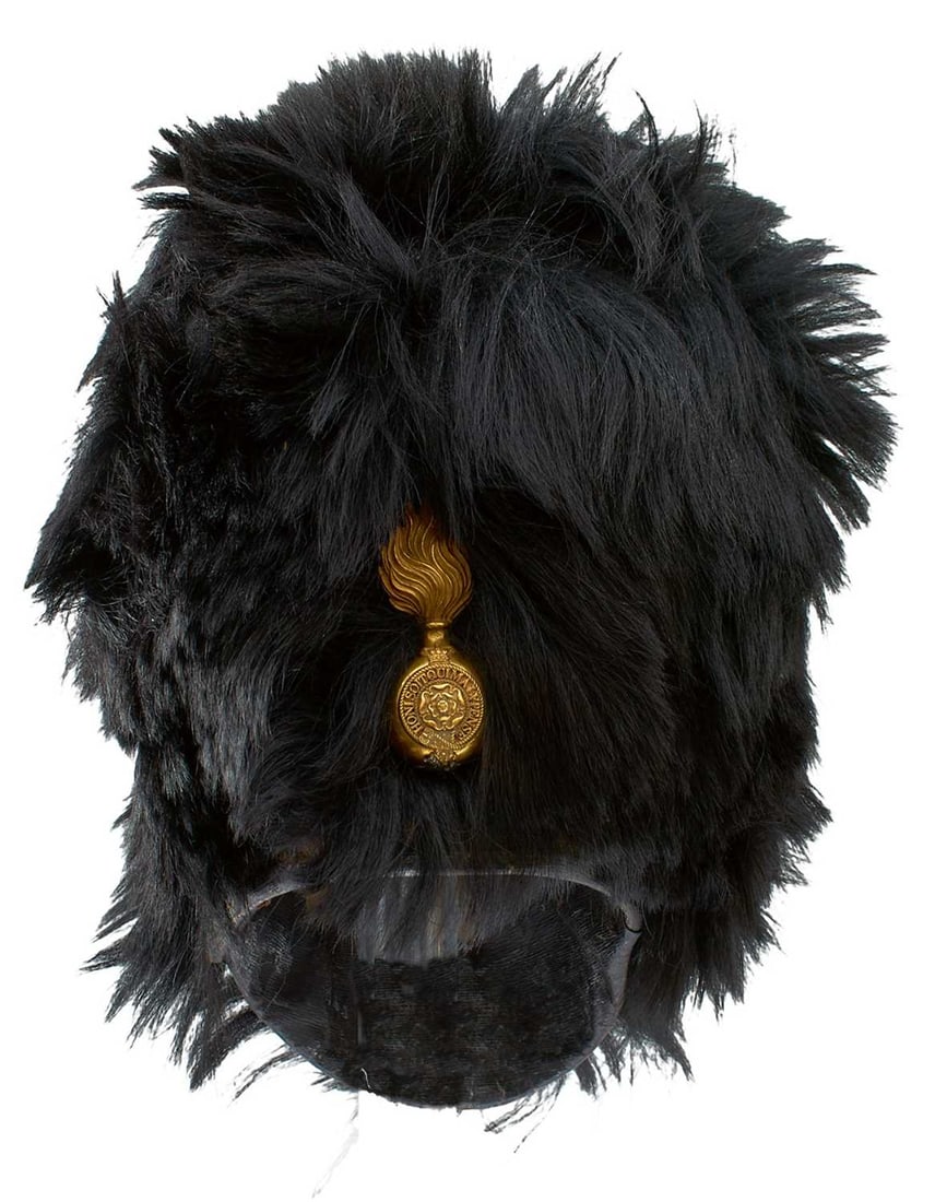A VICTORIAN ROYAL FUSILIER'S BEARSKIN,: the fur covered cane body with flaming grenade badge crowned pierced HONI SOIT QUI MAL Y PENSE in garter form, surmounting a white metal Hanoverian Horse, leather liner, maker's trade label for W.