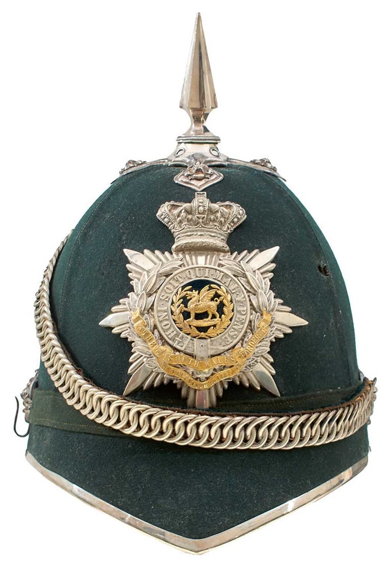 AN OFFICER'S GREEN CLOTH HELMET OF THE 3RD VOLUNTEER BATTALION THE SOUTH WALES BORDERERS,: the green cloth body with white metal mounts, crowned rayed star helmet plate with central garter HONI SOIT QUI MAL Y PENSE, gilt metal dragon centered, laurel wreath surround applied with gilt regime