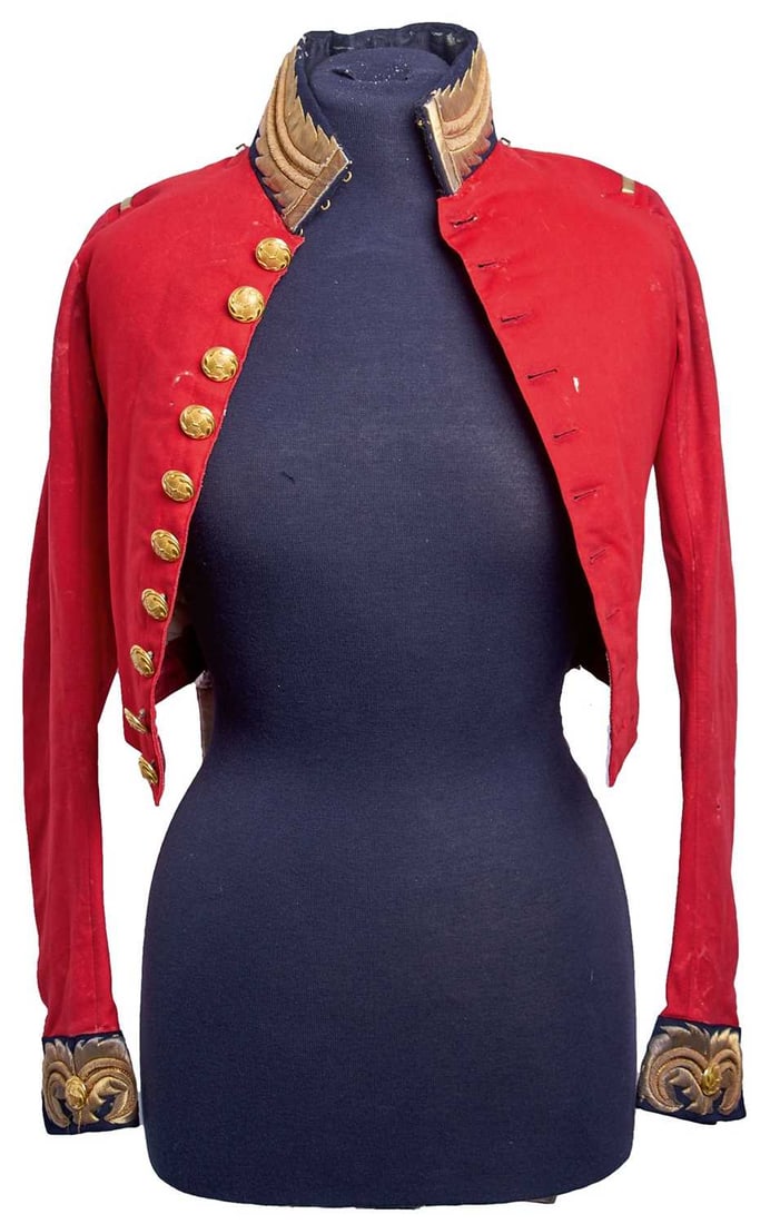 A GEORGIAN OFFICER'S COATEE FOR AN AIDE DE CAMP,: the scarlet cloth coatee body with black cloth collar and cuffs, these with bullion trim and gilt buttons, the front with ten gilt buttons, the white cloth bordered tails with bullion trim to the ends