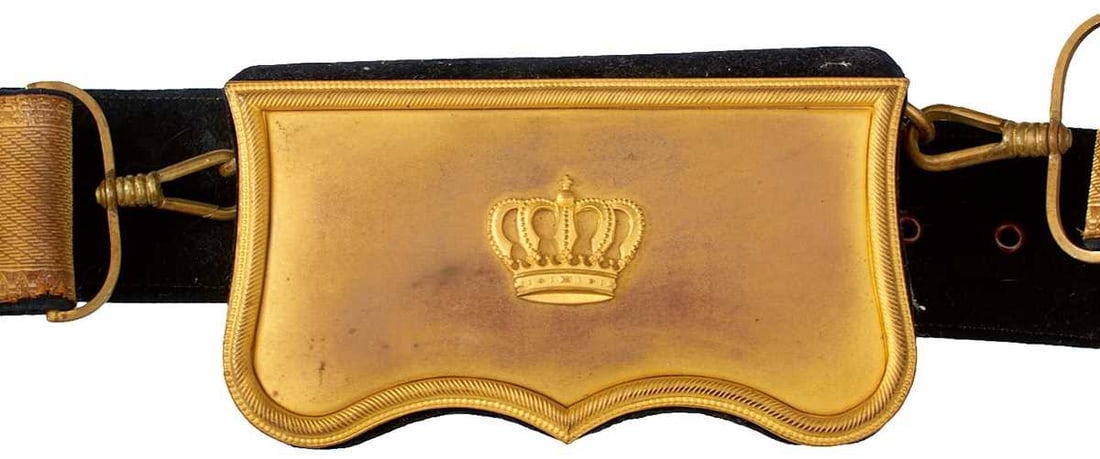 A 20TH CENTURY CONTINENTAL OFFICER'S SHOULDER BELT AND POUCH,: the shaped gilt brass flap with central pierced crown, velvet overed box, black velvet back belt with bullion facing.