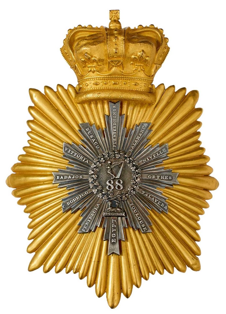 AN 88TH (CONNAUGHT RANGERS) BELL TOP SHAKO PLATE: the gilt rayed star surmounted by a crown, central white metal further rayed star with battle honours FUENTES D'HONOR, SALAMANCA, NIVELLE, ORTHES, TALAVERA, TOULOUSE, EGYPT, PENINSULA, C. RODRIGO, BAD