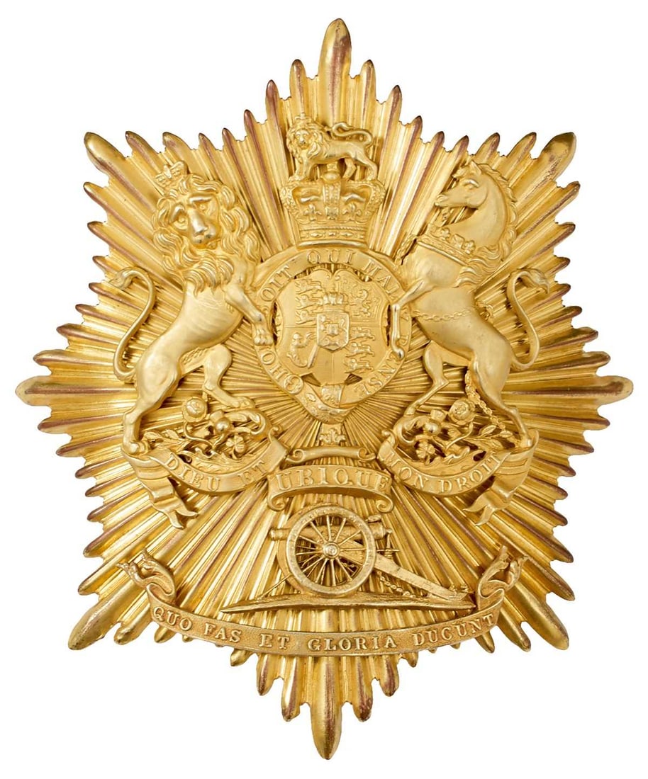 A WILLIAM IV ROYAL ARTILLERY OFFICER'S BELL TOP SHAKO PLATE,: gilt rayed star with applied Royal arms above UBIQUE in a strap and a wheeled cannon, QUO FAS ET GLORIA DUCUNT on a scroll below.