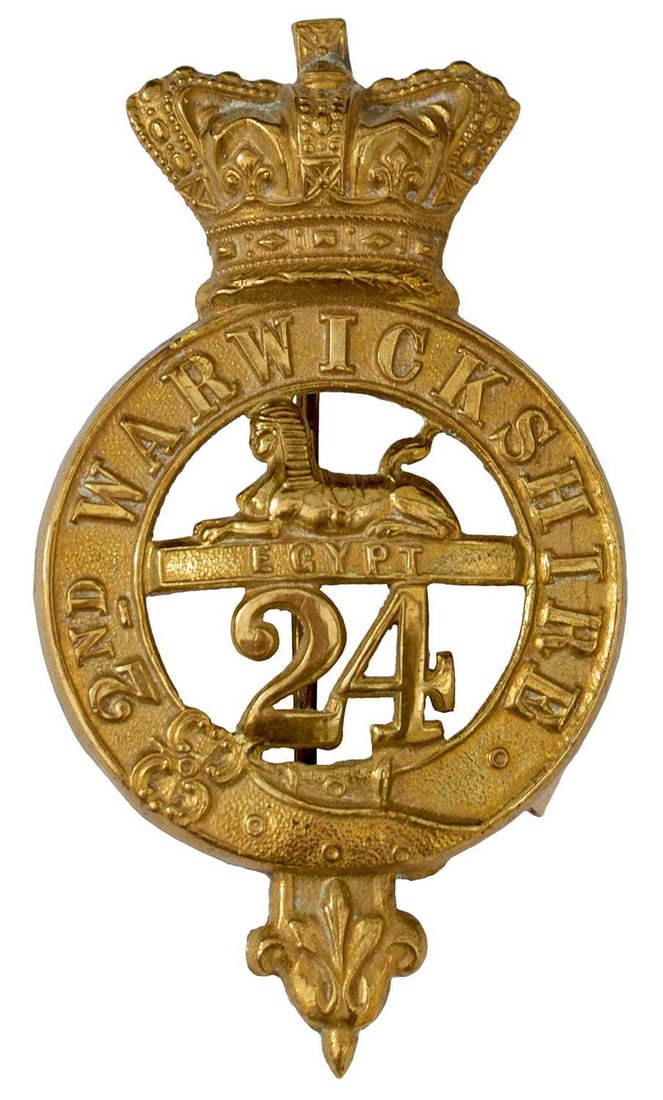 A 24TH REGIMENT OF FOOT (2ND WARWICKSHIRE) GLENGARRY BADGE,: the brass crowned garter 2ND WARWICKSHIRE with pierced central sphinx and EGYPT surmounting 24. One pin eye mount glued.