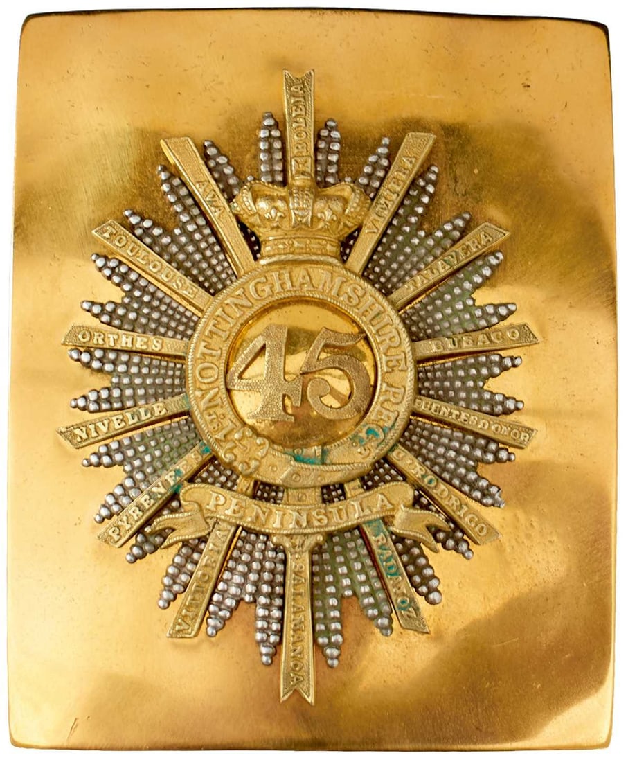 A 45TH (NOTTINGHAMSHIRE) REGIMENT OFFICER'S SHOULDER BELT PLATE,: gilt rectangular plate applied with a white metal rayed star, further applied with gilt 45 surrounded by NOTTINGHAMSHIRE REGT on a crowned strap, PENINSULA below, surrounded by further numerous battle