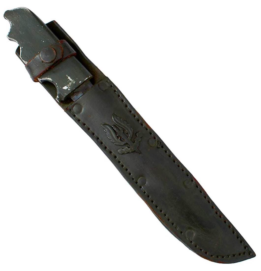 A THEATRE MADE SAS FIGHTING KNIFE,: the blade of a No.5 bayonet mounted in a cast alloy hilt with gripped edge, stamped 1944 an 10/3188, in its leather sheath applied with an SAS badge, the whole with green painted finish. One assumes