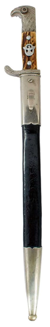 THIRD REICH POLICE BAYONET: 33cm fullered plated bade by Alexander Coppel of Solingen, regulation plated hilt with two-piece riveted horn grips set with the white metal badge, the crossguard stamped S.M.II. 674. in its plated mo