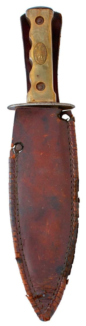 A SCARCE ITALIAN COLONIAL POLICE DAGGER,: 18.25cm flattened leaf-shaped blade stamped PC2226, steel hilt with two-piece shaped hrn grips, the front scale set with an oval brass plaque embossed with the Italian eagle, in its leather sheath.