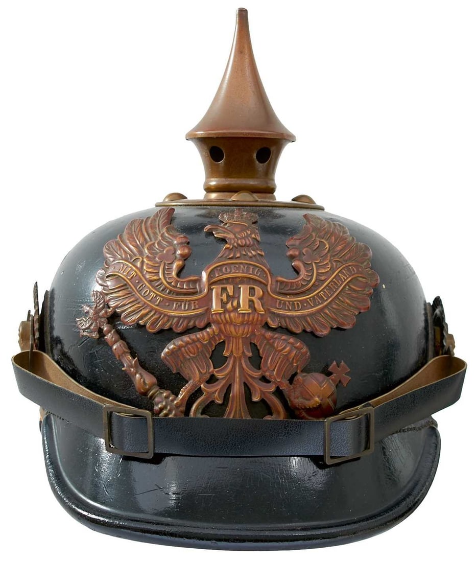 A SCARCE PRUSSIAN OTHER RANKS MODEL 1887 PICKELHAUBE,: the black leather skull with brass fittings, Prussian eagle helmet plate, spike finial, Imperial and State cockades, ersatz chin strap, trimless turned peak, leather liner. The cockade and chin strap